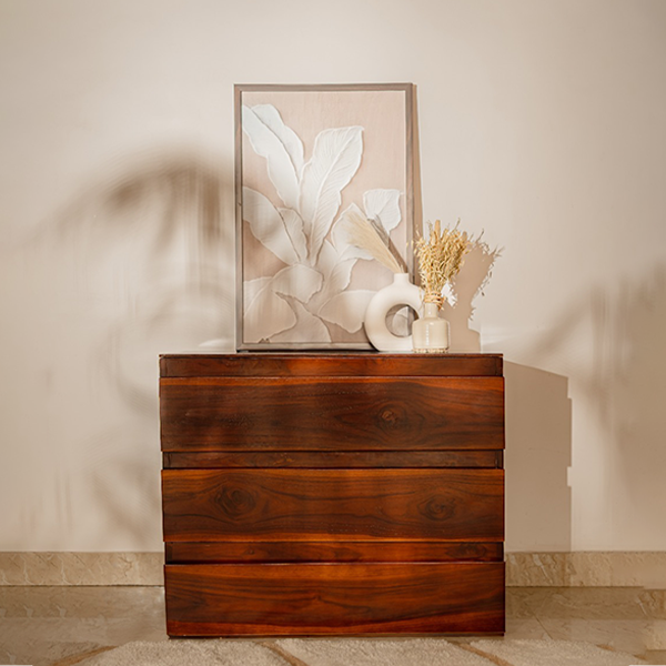 Wooden dresser with decorative items