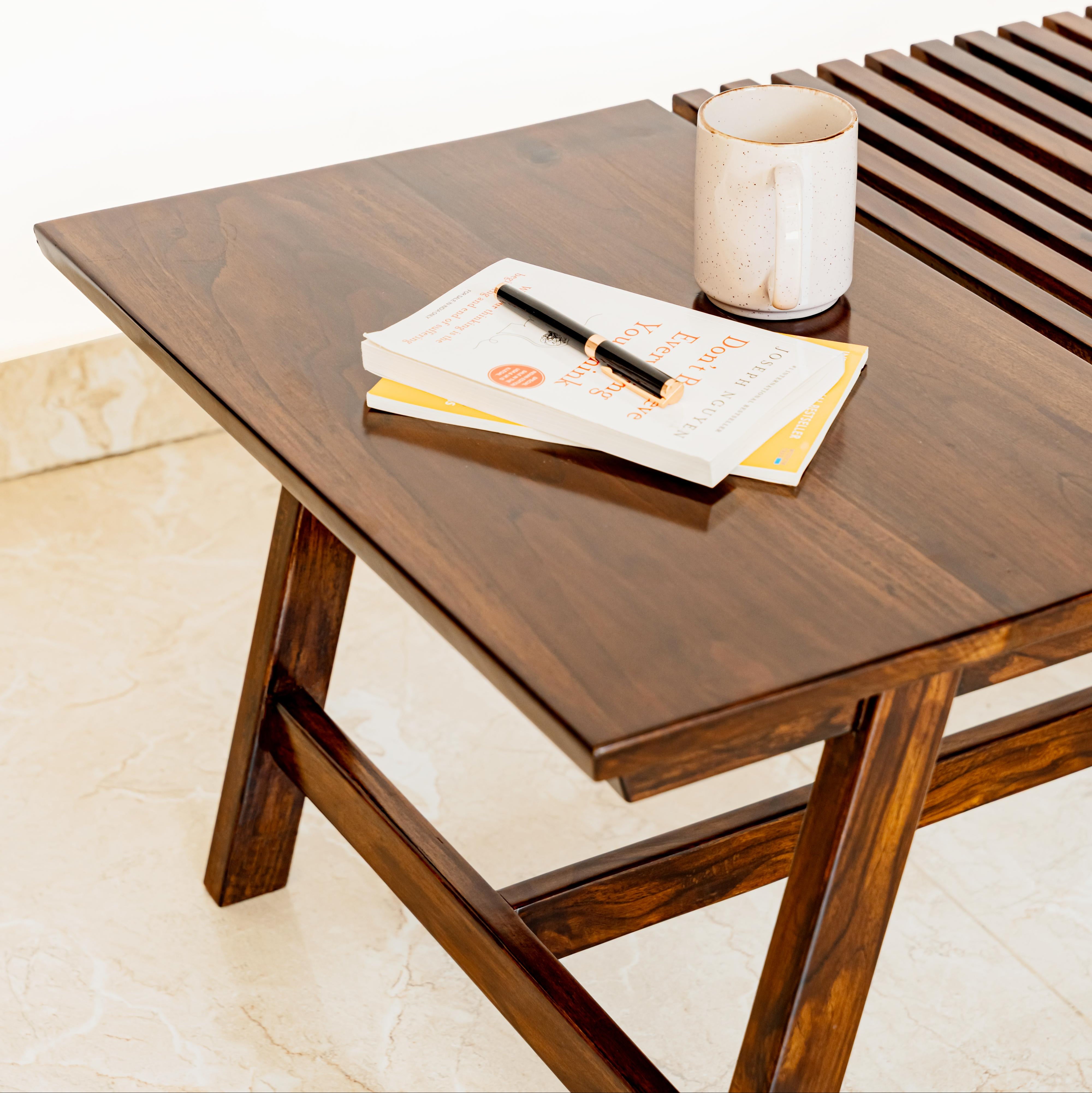 Wooden table with a magazine and pen